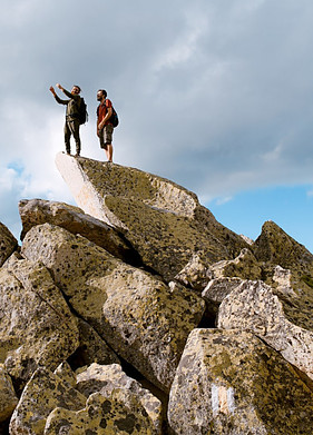 The Power Of Not Giving Up - Two people on top of a mountain